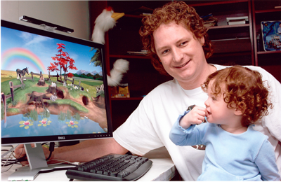 Two-year-old Olive plays The Meadow, a software game for babies designed by her dad, Ken Kavanagh, under his company Clicktoy Interactive Inc.